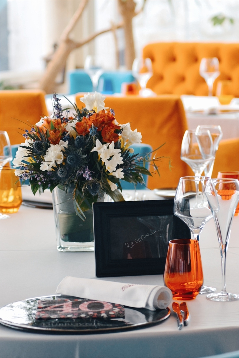 Restaurant Dubrovnik table for two with glasses of wine and beautiful flowers