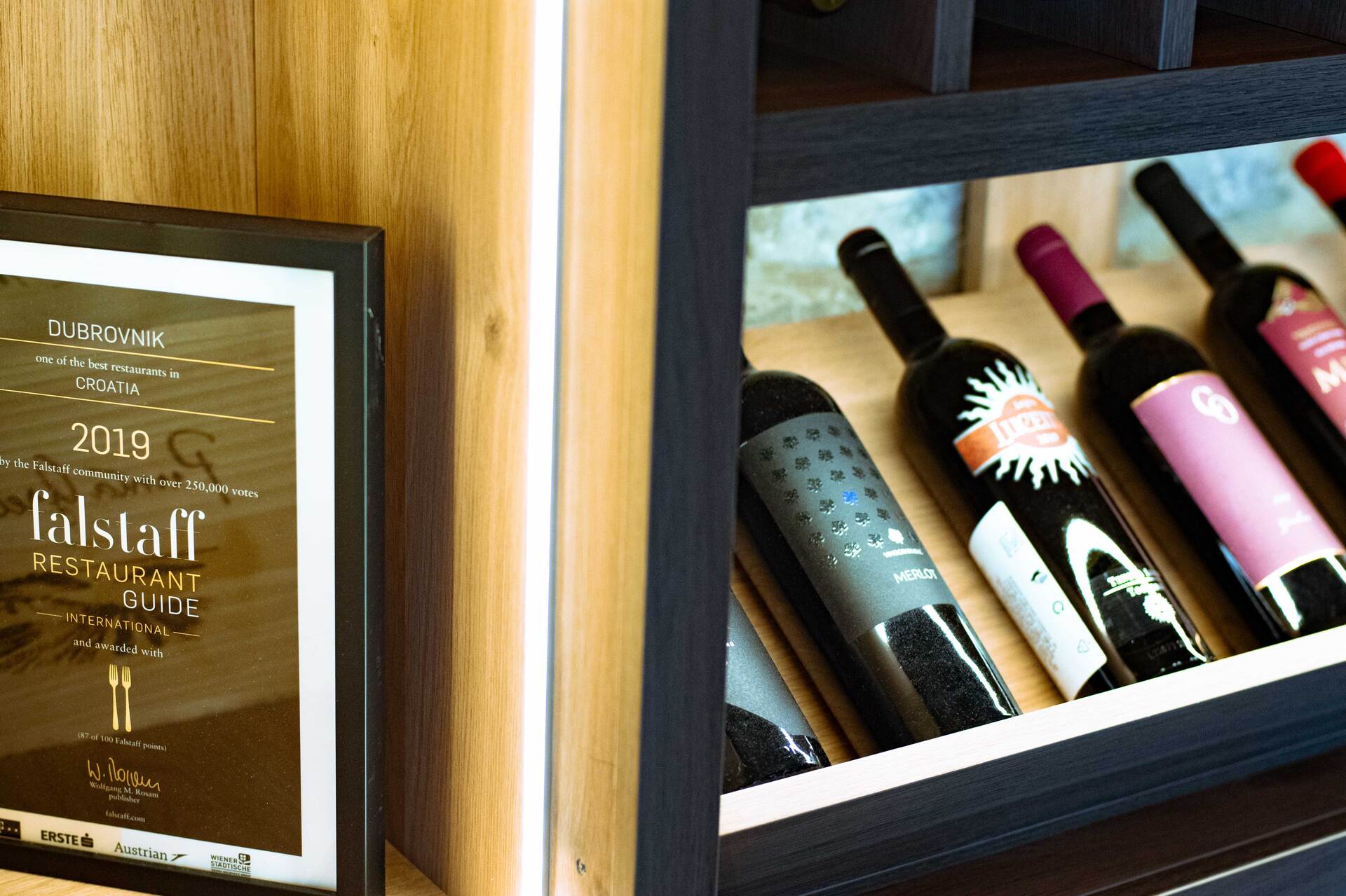 Restaurant Dubrovnik award falstaff - restaurant guide 2019 with wine bottles on right side
