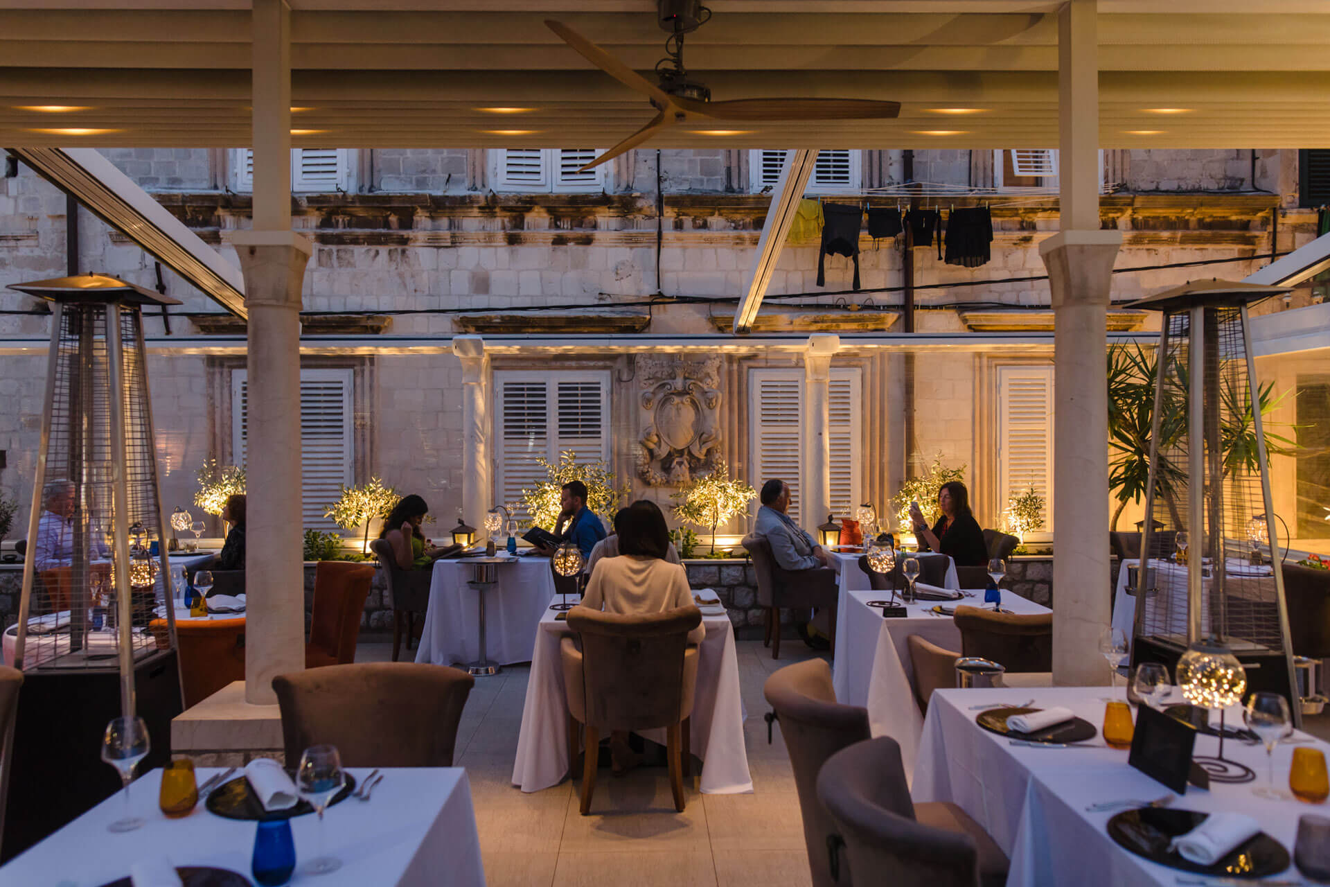 Restaurant Dubrovnik terrace full of guests at night