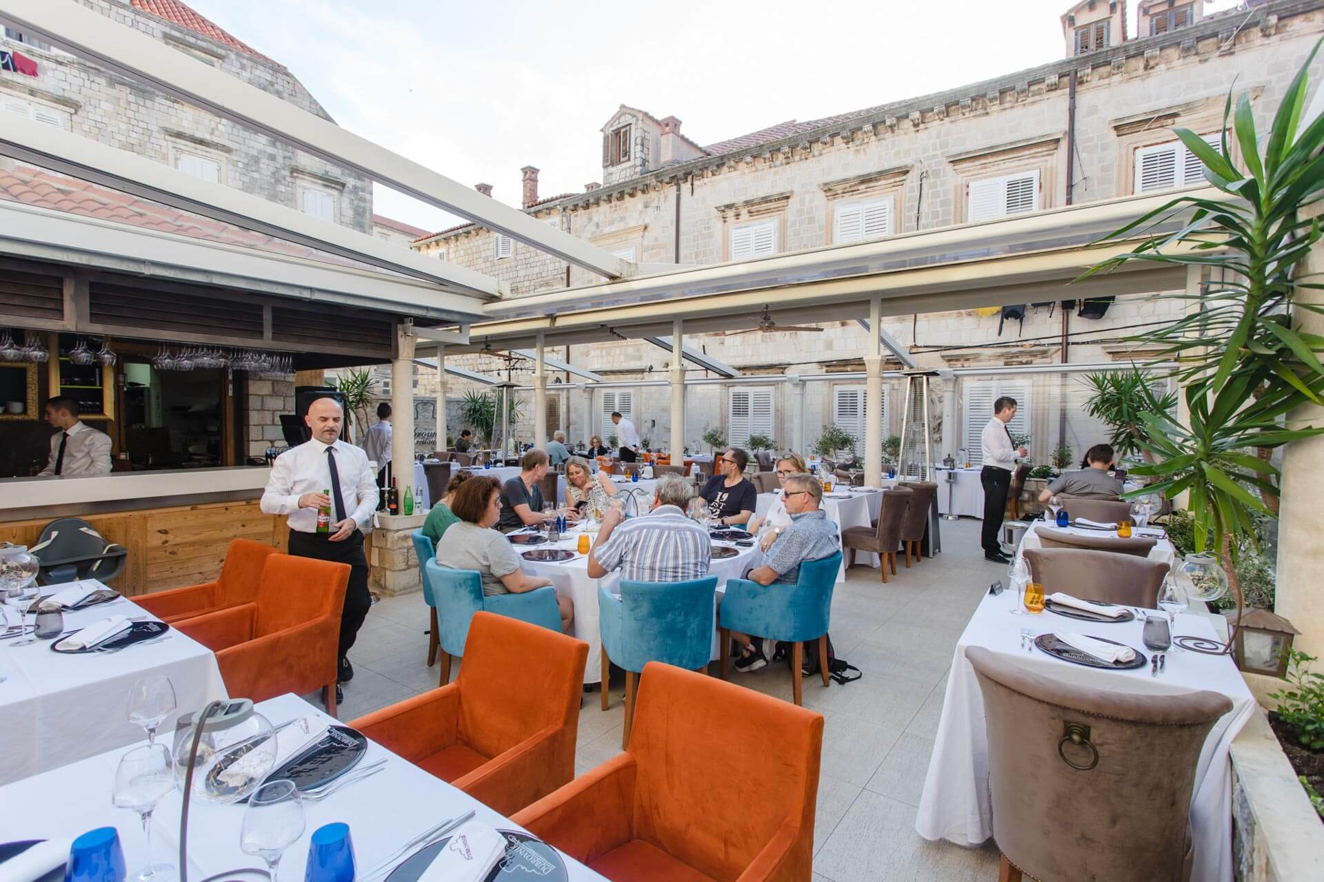 Restaurant Dubrovnik terrace with waiters and guests - Predivna terasa Restorana Dubrovnik u Starom Gradu